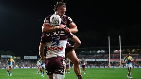 Blake Wilson celebrates the opening try for Manly on Saturday night.