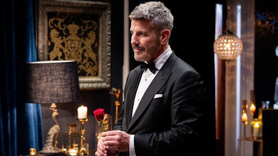 Barry “Bear” Myrden prepares to present a rose in the Golden Bachelor’s first rose ceremony