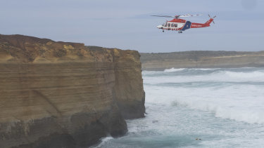 A helicopter carries out the rescue operation.