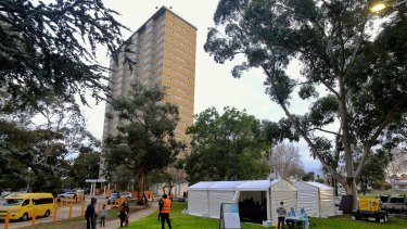 Health staff prepare a COVID testing site at the Flemington public housing tower in Melbourne. 