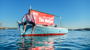 Labor candidate Tim Murray, with his uncle John Murray's boat.