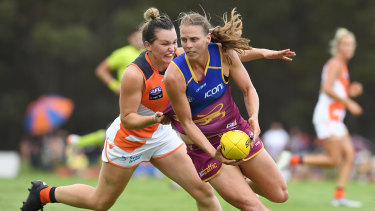 Gripping: Brisbane's Kate Lutkins is chased down by Alyce Parker of the Giants.