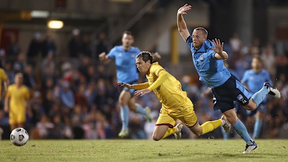 Craig Goodwin is fouled by Rhyan Grant late in the match. 
