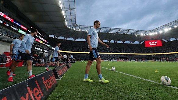 Alex Wilkinson leads Sydney FC out onto Bankwest Stadium for a warm-up before what was probably their last game of the A-League season.