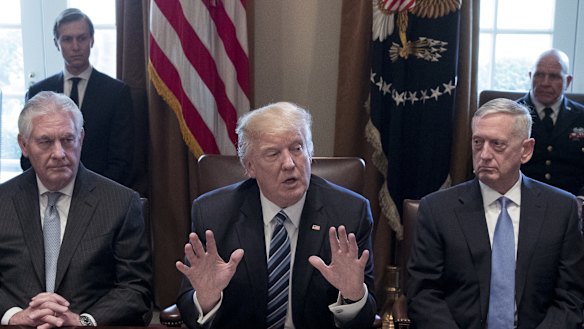 Donald Trump, centre, with James Mattis, right, and Rex Tillerson, then secretary of state last year. 