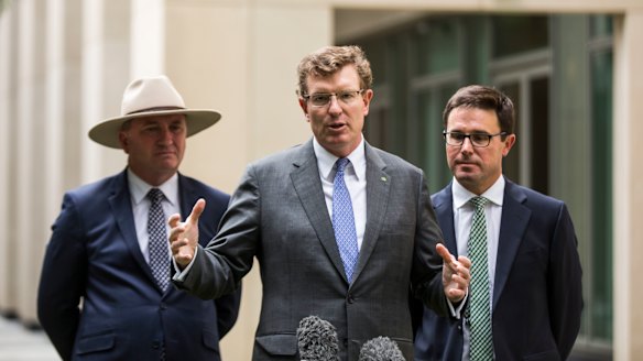 Nationals minister Andrew Gee (centre) has warned his party will need assurances before supporting the proposed university overhaul. 