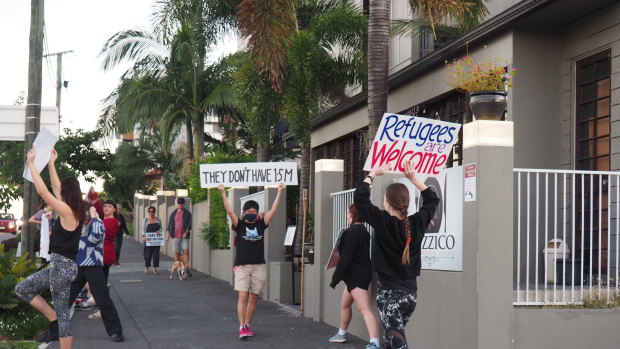 Community members arrive at the makeshift detention centre in Brisbane each Friday to protest.