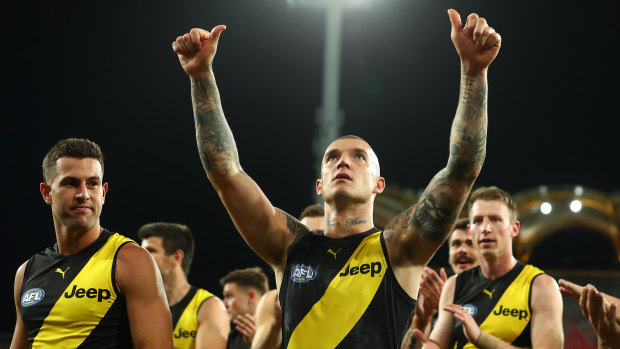 Dustin Martin and his teammates celebrate winning in round 17. 