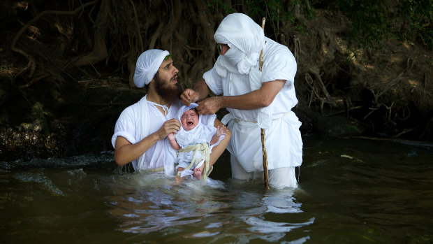 Dressed in white cloth, Sydney’s Mandaean community gathered on the bank of Penrith's Nepean River on Friday.