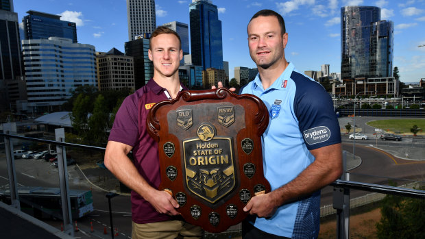Daly Cherry-Evans and Boyd Cordner pose with the State of Origin shield on Friday.