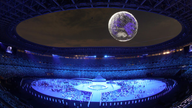 A drone display of the Tokyo Games emblem is seen over the top of the stadium during the opening ceremony.