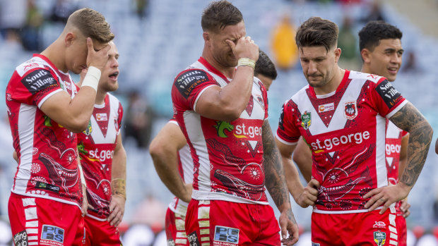 Dejected: Dragons players react during the 24-10 loss to South Sydney.