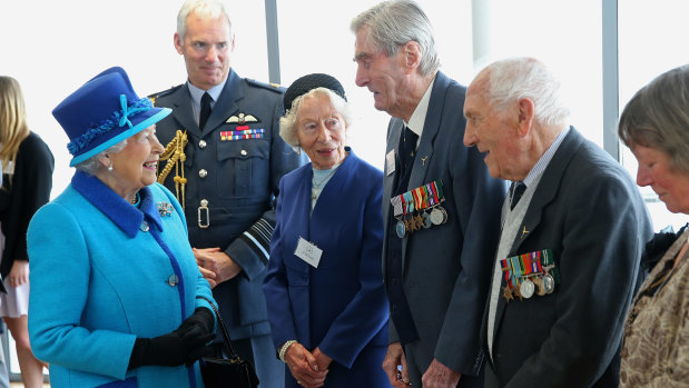 The Queen meets Mrs K Foster (left), wing commander Paul Farnes (centre) and squadron leader Tom Pickering in 2015.