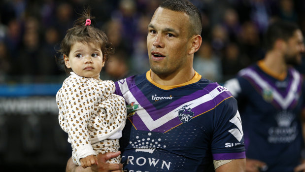 'Loving father': Chambers with his daughter after the Storm's win over Cronulla in the preliminary final.