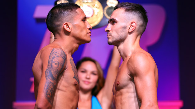 Joshua Franco (L) and Australia Andrew Moloney (R) face-off during the weigh in for the WBA super flyweight championship.