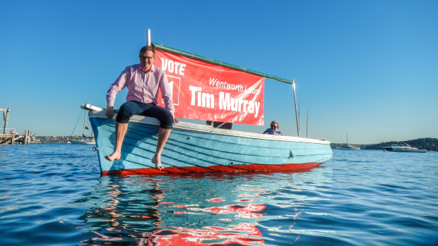 Labor candidate Tim Murray, with his uncle John Murray's boat.