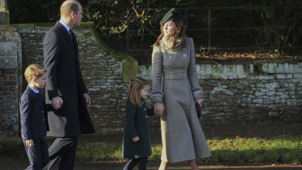 Prince George, 6, and Princess Charlotte, 4, walk hand-in-hand with their parents, Prince William and Catherine, the Duchess of Cambridge,