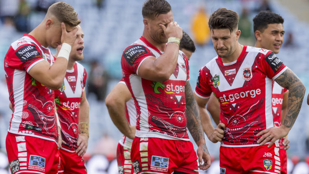 Dejected: Dragons players react during the 24-10 loss to South Sydney.