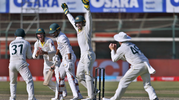 Australian wicketkeeper Alex Carey celebrates the dismissal of Pakistan’s Faheem Ashraf during the second Test.