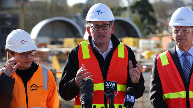Premier Daniel Andrews (centre) with Public Transport Minister Jacinta Allan (left) and Roads Minister Luke Donnellan at the new North Melbourne station site on Wednesday.