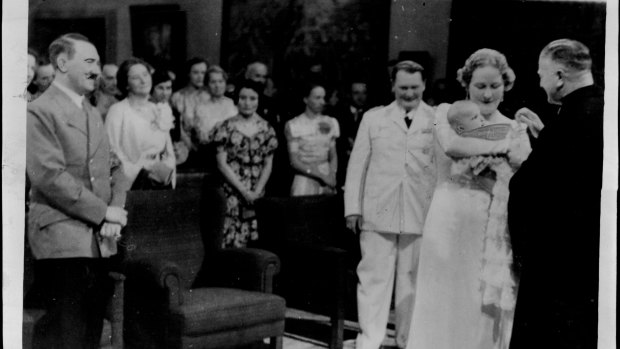 Goering's daughter Edda christened - Hitler as a proud godfather looks on, 1938.