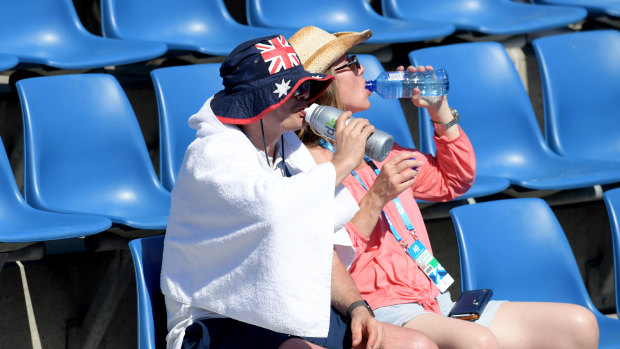 These fans know the drill: hats, water and protective clothing (and a towel!).