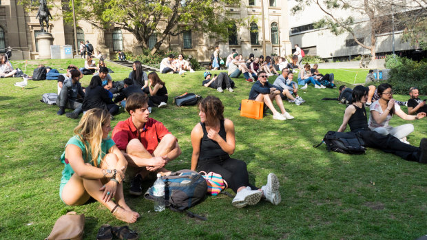 Students on the lawn (pre-lockdown) in front of Melbourne's State Library.