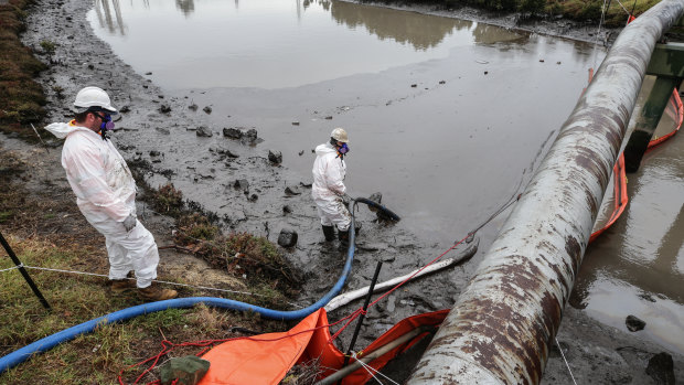 Clean-up crews pumped chemicals and fire retardant from the factory fire out of Stony Creek.