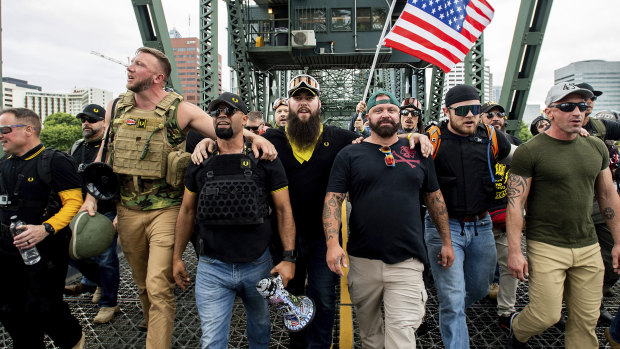 Proud Boys chairman Enrique Tarrio, holding a megaphone, with right-wing demonstrators in Portland, Oregon, in 2019.