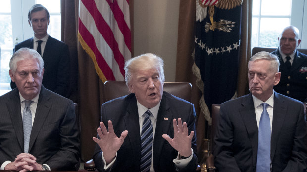 Donald Trump, centre, with James Mattis, right, and Rex Tillerson, then secretary of state last year. 
