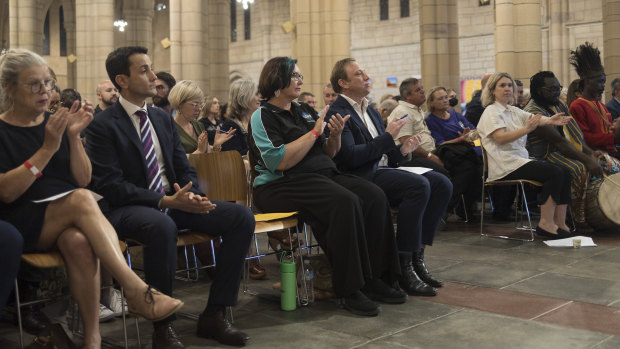 LNP Opposition Leader David Crisafulli (front, second from left) and Miles (fourth from left) hear the views of the Queensland Community Alliance at St John’s Anglican Cathedral.