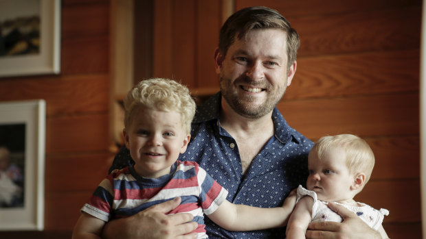 Blake Woodward earlier this year at home with three-year-old son Samuel Woodward and eight-month-old daughter Michaela.