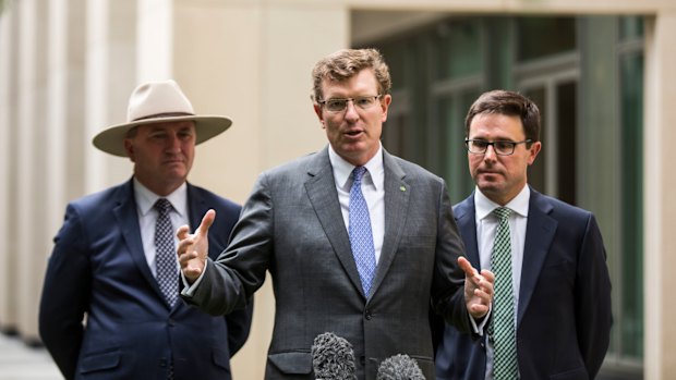 Nationals minister Andrew Gee (centre) has warned his party will need assurances before supporting the proposed university overhaul. 