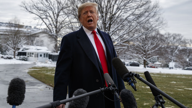 US President Donald Trump talks with reporters on the South Lawn of the White House before departing for the American Farm Bureau Federation's 100th Annual Convention in New Orleans.