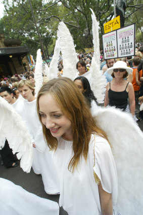 "White-winged peace angels" join the protest.