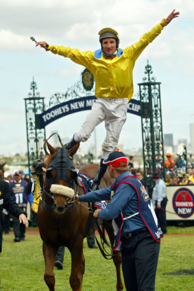 Oliver jumping off Media Puzzle after his incredible 2002 Melbourne Cup win.