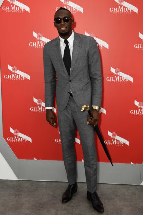 Usain Bolt at the Mumm champagne marquee.