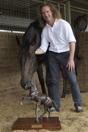 Ciaron Maher with star two-year-old Cellsabeel and the Inglis Millennium trophy