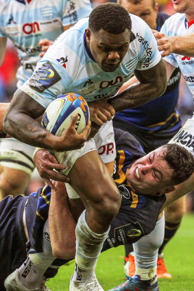 Lucky charm: James Ryan makes a tackle on Racing's Virimi Vakatawa in the European Champions Cup final. 