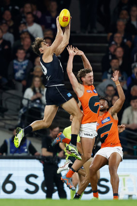 Curnow flies for a mark over the Giants’ Harry Perryman in the round 24 match.