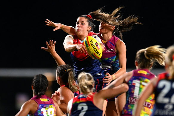 Melbourne’s Lauren Peace fights for the ball againt the Lions.