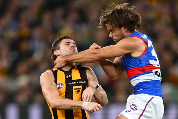 Lachlan McNeil of the Bulldogs takes Nick Watson of the Hawks high.