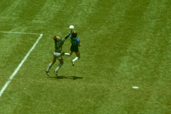 Maradona outjumps England goalkeeper Peter Shilton to score his 'Hand of God' goal.