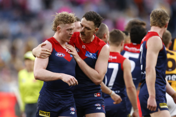 Clayton Oliver with teammate Jake Lever.