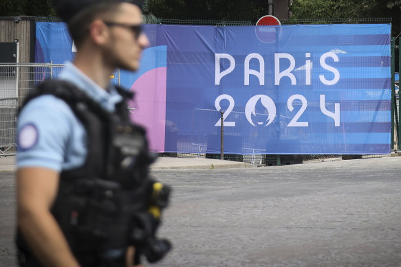 A police officer patrols the streets of Paris on Saturday.