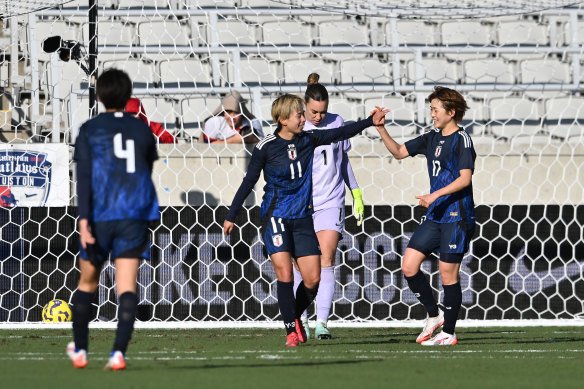 Mina Tanaka scores her second goal for Japan.