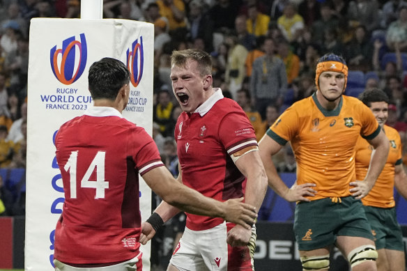 Wales’ Nick Tompkins celebrates after scoring a try.