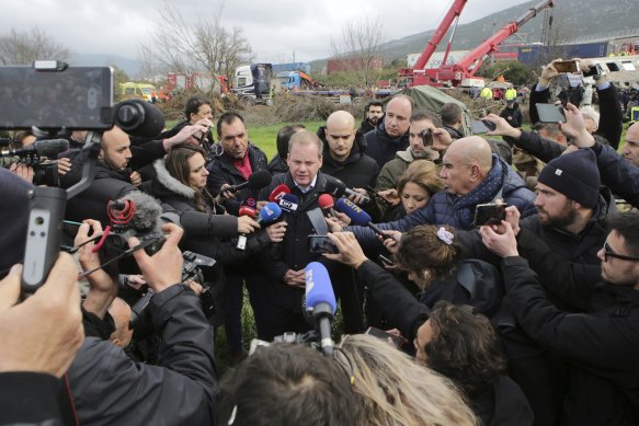 Transport Minister Kostas Karamanlis addresses the media during his visit to the site of the tragedy.