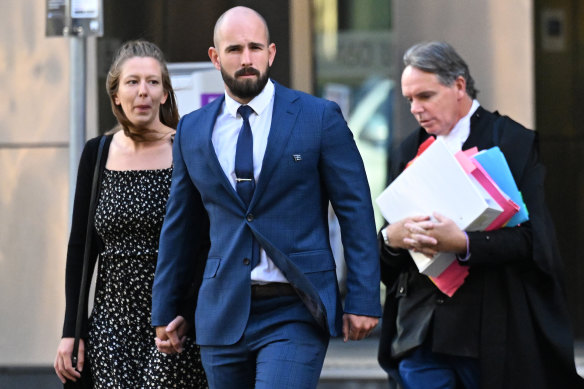 Thomas Sewell (centre), arrives at the appeal hearing with his partner (left) and barrister Dermot Dann, KC.