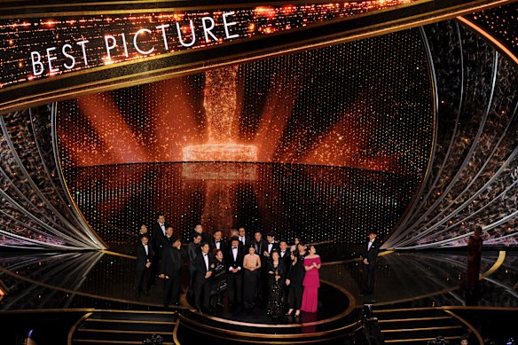 The cast and crew of Parasite accept the award for best picture at this year's Oscars.